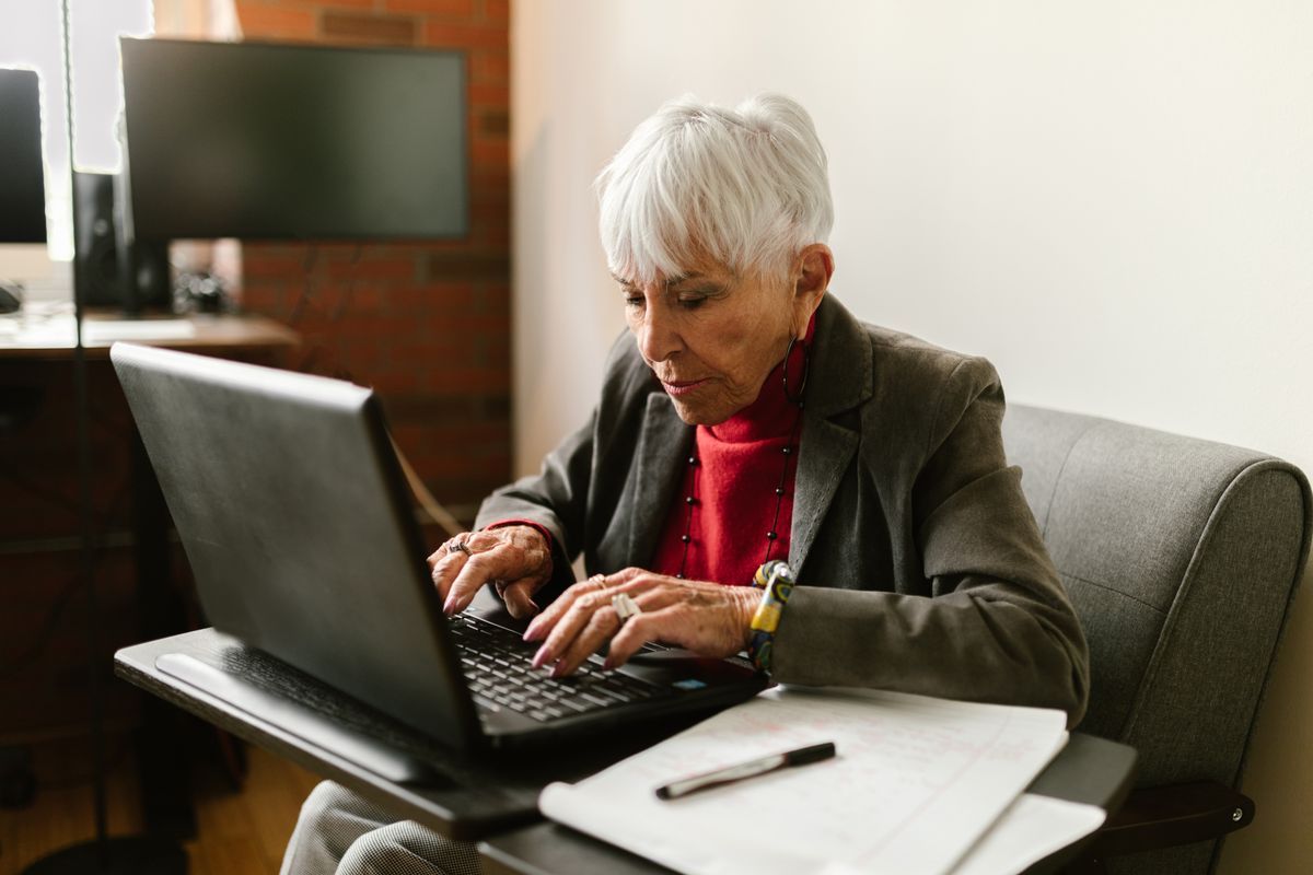 Senior woman working on a laptop at home